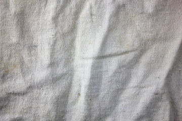White old shabby fabric texture.White material woven stained old.