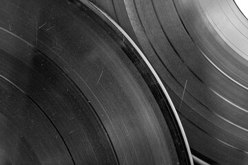 Vinyl records close-up black and white image. Vinyl background. Original authentic scratched old...