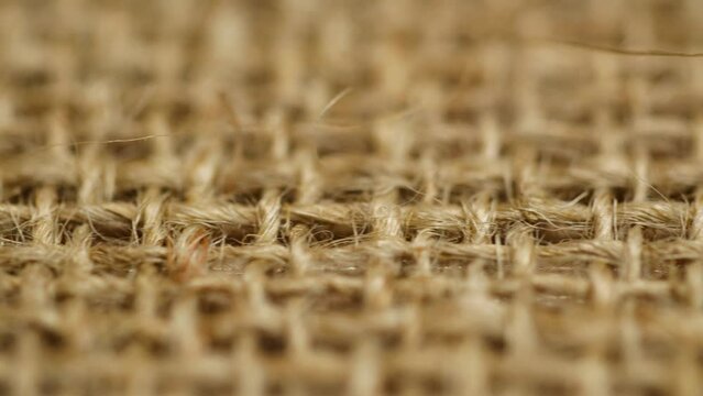 Macro brown vintage jute sack texture, closeup burlap fabric textile background