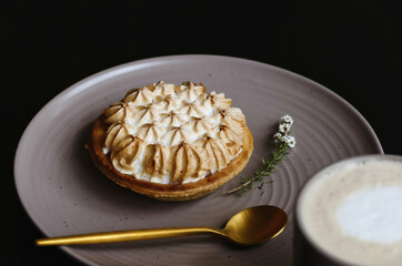 Lemon meringue dessert fresh off a bakery