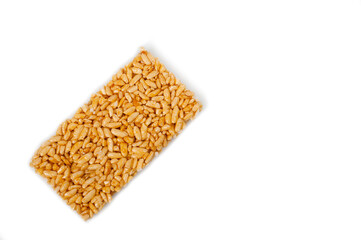 Sweetness from grains of puffed rice, shot close-up on a white background.