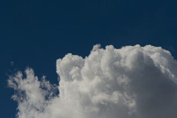 Moody clouds. Blue sky background. Low key photo. Copy space