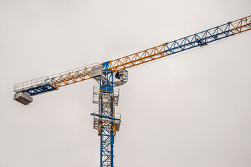 Lifting tower crane at housing construction