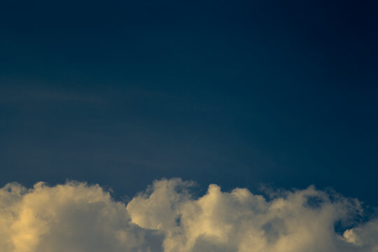 Moody clouds on a blue background. Evening time. Low key photo. Copy space © suttiphan
