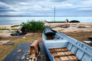 colorful boats being repaired on a torreira beach of the Aveiro lagoon, Portugal