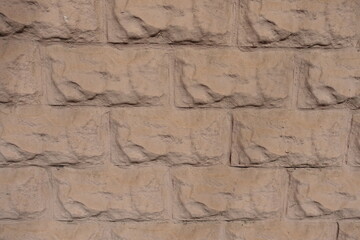 Backdrop - light brown painted brick veneer wall