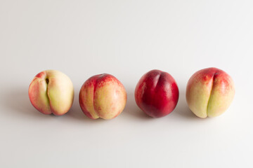Nectarine. Four Nectarines isolated nectarines on white background. Four nectarines in a row