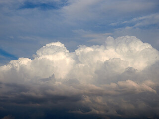 Fototapeta na wymiar Cumulus clouds. White clouds on the blue sky close-up.
