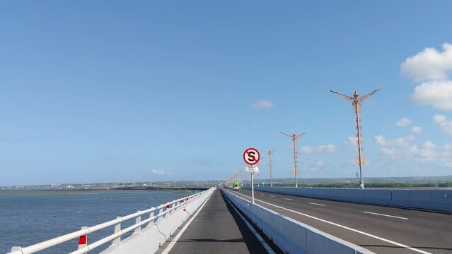 Driving at Bali Mandara Floating Toll Road Above the Sea Indonesia