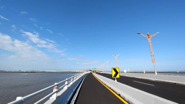 Driving at Bali Mandara Floating Toll Road Above the Sea Indonesia
