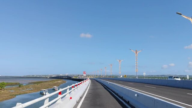 Driving at Bali Mandara Floating Toll Road Above the Sea Indonesia