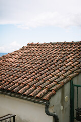 Old roof with red tiles in a European village.