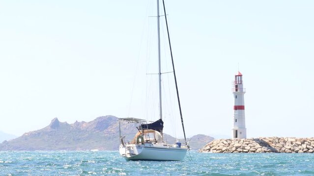 Sailing Boat by the Lighthouse (4K)