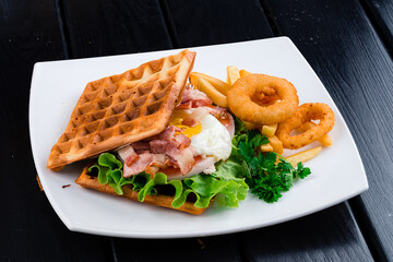 viennese waffles with poached egg and ham for breakfast