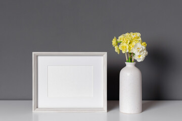 Landscape photo frame mockup with daffodils flowers