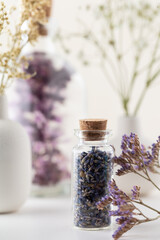 Obraz na płótnie Canvas Dried lavender flowers with bottle. Homeopathy background.