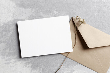 Wedding invitation card mockup with envelope and dry flowers