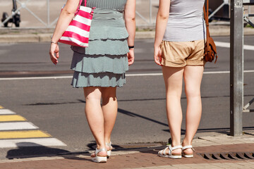 people crossing the road at a pedestrian crossing