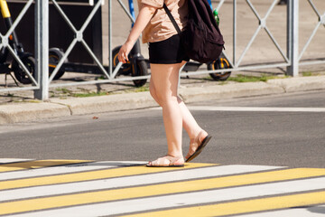 people crossing the road at a pedestrian crossing