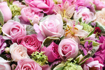 Delicate blooming festive light pink roses and bright flowers, blossoming rose flower  background, bouquet floral card, selective focus, shallow DOF