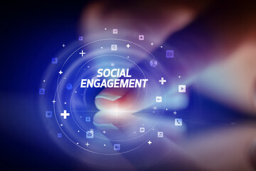 Finger touching tablet with social media icons concept