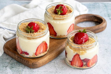Strawberry magnolia. Dessert with cream and strawberry filling on a stone background. World cuisine...
