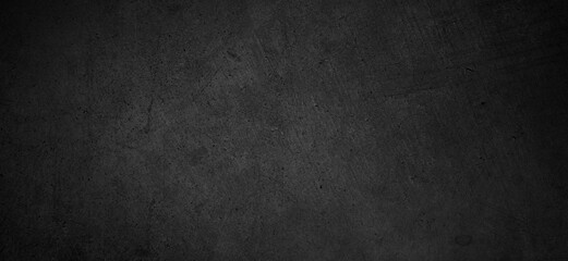 Dark black grunge textured concrete background. Panorama dark grey black slate background or texture