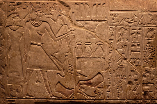 Hieroglyphic carving on an ancient Egyptian sargophagus in an ancient temple, selective focus