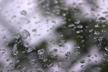 Raindrops on a car window. Macro photo.