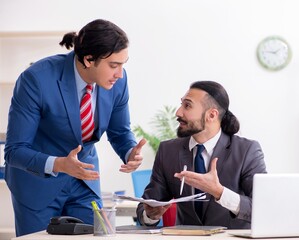 Two male colleagues in the office