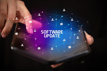 Businessman holding a foldable smartphone, new technology concept