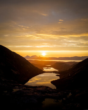 Sunset in the distance seen from a valley