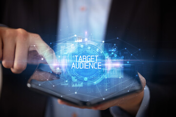 Young man holding a foldable smartphone