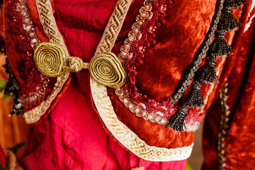 Details and textures of the fabric of a traditional Greek dress.
