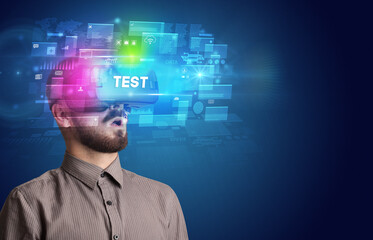 Businessman looking through Virtual Reality glasses