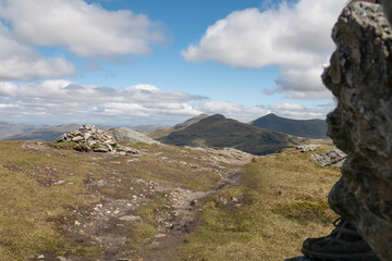 View of the mountains in the Scottish Trossachs National Park from the peal of An Caisteal. Beautiful green Scottish mountainous scenery in summer 