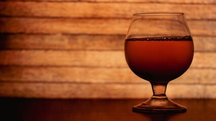 glass of beer on table on the nature background