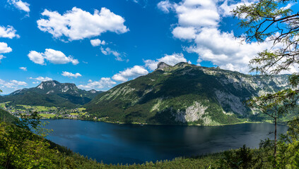 Naklejka na ściany i meble Stunning aerial panorama view of Altaussee lake with the peaks Standling, Loser, Hochanger, Greimuth on a sunny summer day, Salzkammergut Ausseerland region, Styria, Austria