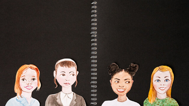 Back to school concept. Portraits of schoolchildren on a black background.