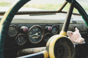 The dashboard in an old car close-up. Speedometer and gauges
