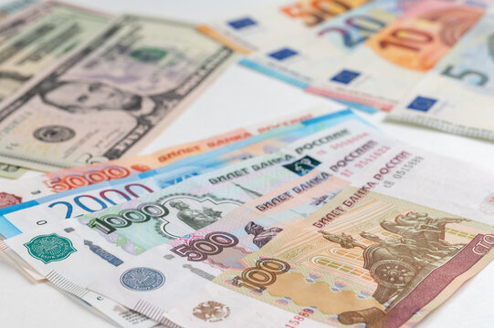 Money from different countries: dollars, euros, rubles. International currencies background.