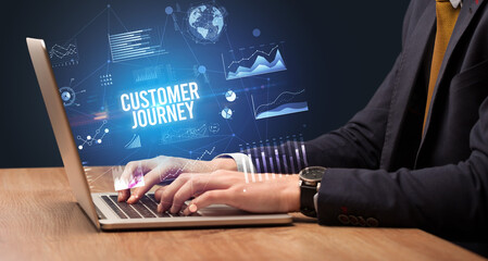 Businessman working on laptop, business concept