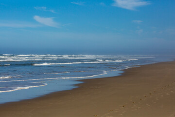 Breakers coming down on Heceta Beach in Florence, Oregon