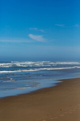 Breakers coming down on Heceta Beach in Florence, Oregon