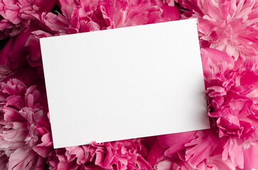 Blank greeting card mockup with pink peony flowers