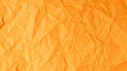 The orange paper background is wrinkled, creating a rough texture with light and shadow.