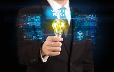 Businessman holding a light bulb, online security concept
