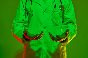 Cropped image of male doctor with hands in air