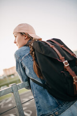 Tourist admires the overview of the sights of the city. Woman with backpack enjoy beautiful city view, traveler mock up top of the city. - 517356664