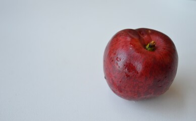 Fresh organic nectarines on a white background